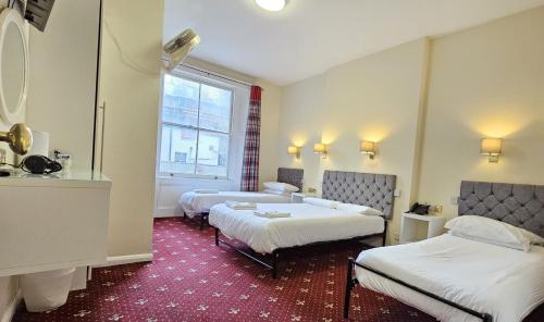 Habitación cuádruple del hotel Hyde Park Court. Foto 5