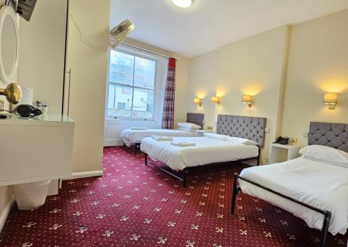Habitación cuádruple del hotel Hyde Park Court. Foto 14