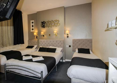 Habitación cuádruple del hotel Hyde Park Court. Foto 37