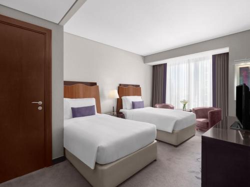 Guest Room – King or Twin Beds - 11:30am Early Check - In, 3pm Late Check - Out, Breakfast Included del hotel Rose Rayhaan By Rotana. Foto 2