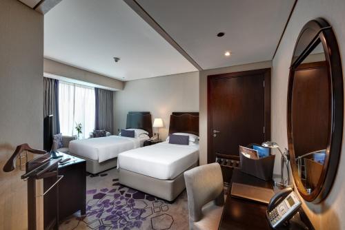 Guest Room – King or Twin Beds - 11:30am Early Check - In, 3pm Late Check - Out, Breakfast Included del hotel Rose Rayhaan By Rotana. Foto 3