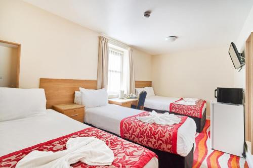 Habitación Cuádruple del hotel Cranbrook. Foto 1