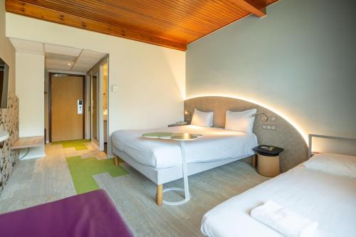 Habitación Doble Estándar con sofá del hotel Ibis Styles Colmar Nord. Foto 4