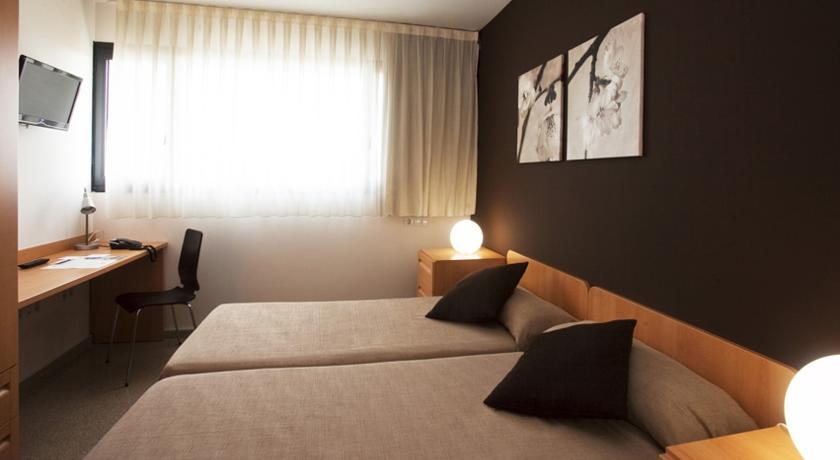 Habitación doble del hotel Villa Alojamiento Y Congresos - Villa Universitaria. Foto 3