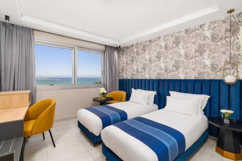 Habitación Doble Superior con 2 camas y vistas al mar del hotel Kenzi Solazur. Foto 3