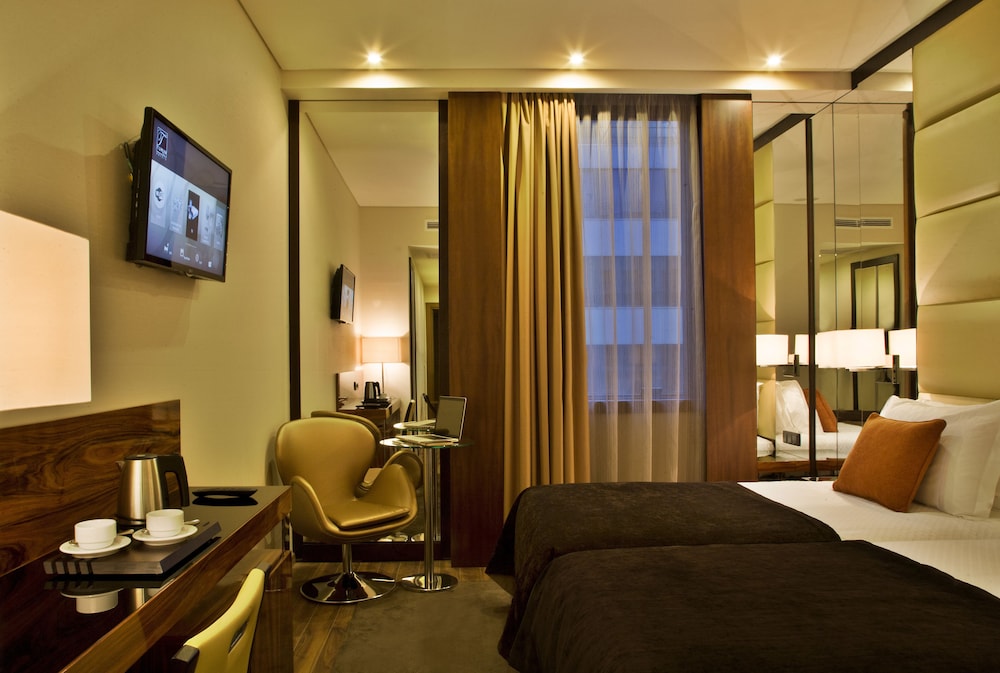 Habitación superior con 2 camas individuales del hotel Turim Av Liberdade. Foto 1