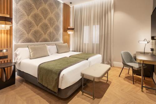 Habitación Familiar Deluxe del hotel Catalonia Atocha. Foto 1