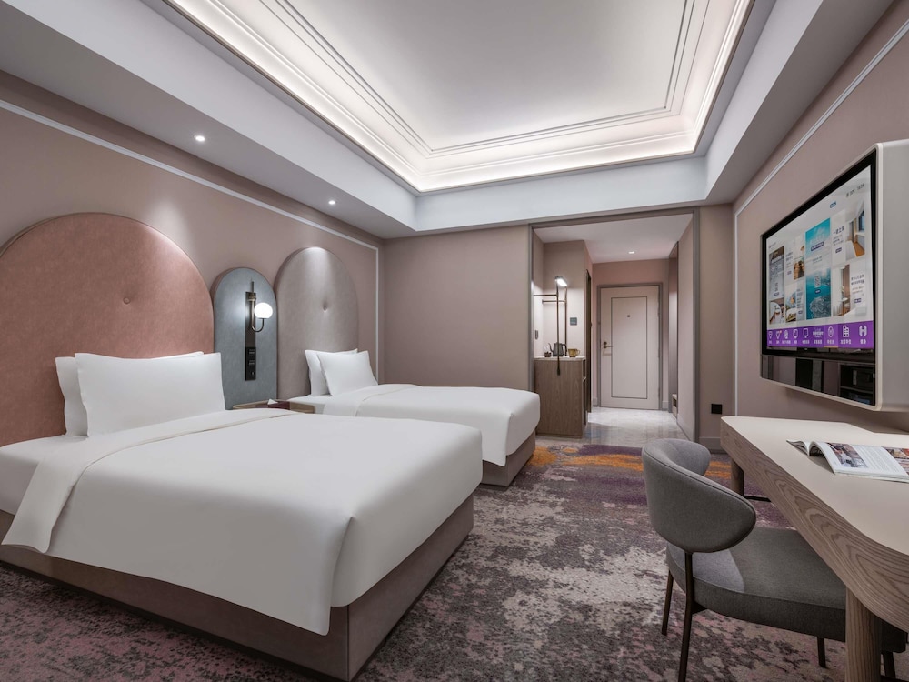 Habitación estándar con dos camas individuales del hotel Mercure Beijing Downtown. Foto 2