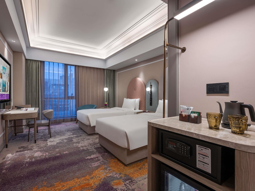 Habitación Superior con Dos Camas Individuales del hotel Mercure Beijing Downtown. Foto 2