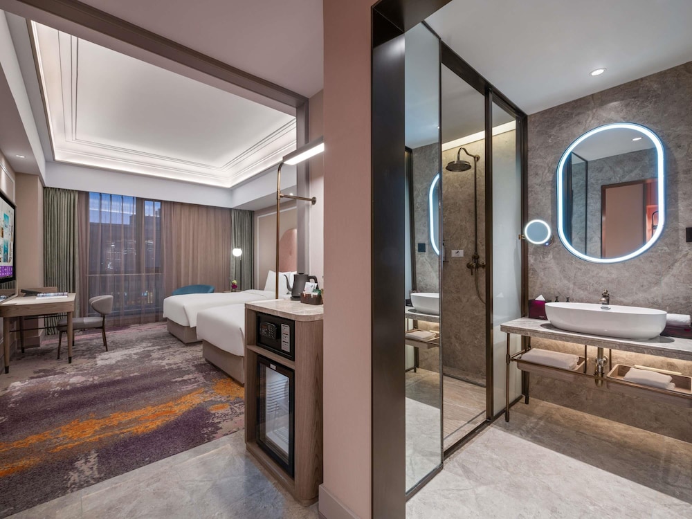Habitación Superior con Dos Camas Individuales del hotel Mercure Beijing Downtown. Foto 4