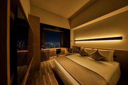 Habitación doble 38F con acceso al salón - Planta executive del hotel The Royal Park Iconic Tokyo Shiodome. Foto 4