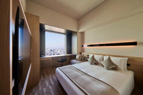 Habitación doble 38F con acceso al salón - Planta executive del hotel The Royal Park Iconic Tokyo Shiodome. Foto 10