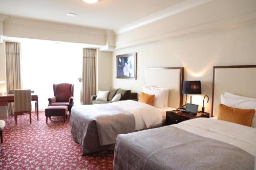 Habitación Doble Deluxe - 2 camas individuales - Planta imperial del hotel Imperial , Tokyo. Foto 1