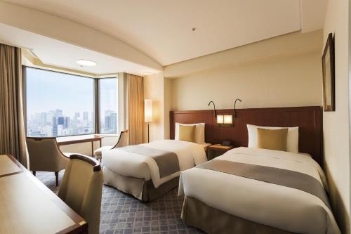 Habitación Doble Estándar - 2 camas - Planta superior del Edificio Torre El día 2 de enero, se espera que los restaurantes estén concurridos, y la disponibilidad estará sujeta a la capacidad. El check - in en el hotel se puede hacer a partir de las 1 del hotel Imperial , Tokyo
