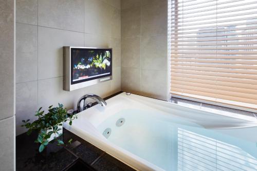 Habitación Triple Premium - No fumadores del hotel Niwa Tokyo. Foto 4