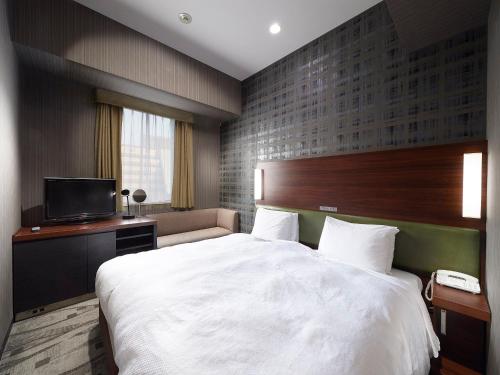 Habitación Doble Económica para fumadores - 2 camas del hotel Sotetsu Grand Fresa Tokyo-Bay Ariake. Foto 1