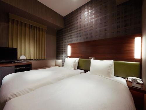 Habitación Doble Económica para fumadores - 2 camas del hotel Sotetsu Grand Fresa Tokyo-Bay Ariake. Foto 4