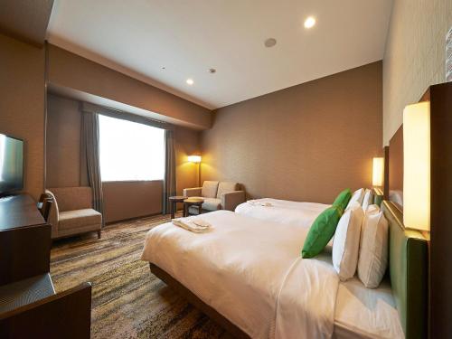 Habitación Doble Deluxe para no fumadores - 2 camas individuales del hotel Sotetsu Grand Fresa Tokyo-Bay Ariake. Foto 1