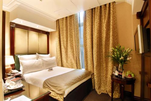 Habitación Doble Deluxe del hotel The Premier Notting Hill. Foto 2