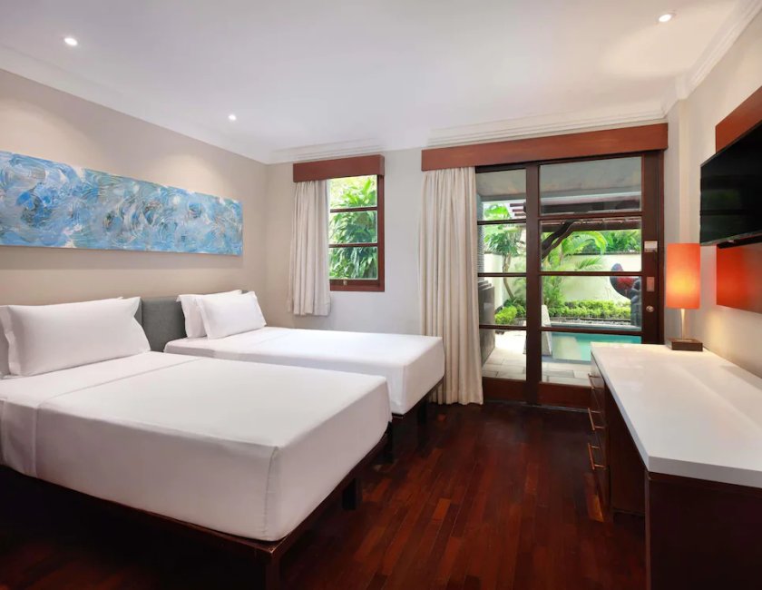 Suite Vista Jardín 1 Cama king 2 habitaciones piscina 2 Camas individuales kitchenette del hotel Novotel Bali Nusa Dua Hotel & Residence. Foto 1