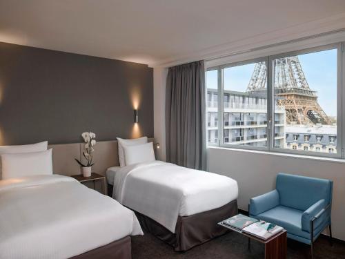 Habitación Doble Superior con vistas a la torre Eiffel - 2 camas del hotel Pullman Paris Tour Eiffel. Foto 2