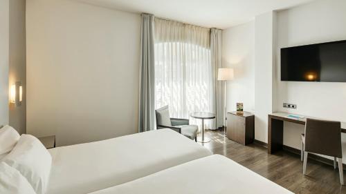 Habitación Doble Estándar - 1 o 2 camas del hotel Sercotel Coliseo. Foto 1