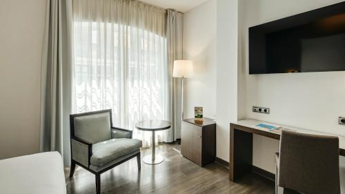 Habitación Doble Estándar - 1 o 2 camas del hotel Sercotel Coliseo. Foto 4