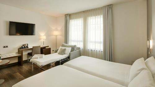 Habitación Triple del hotel Sercotel Coliseo