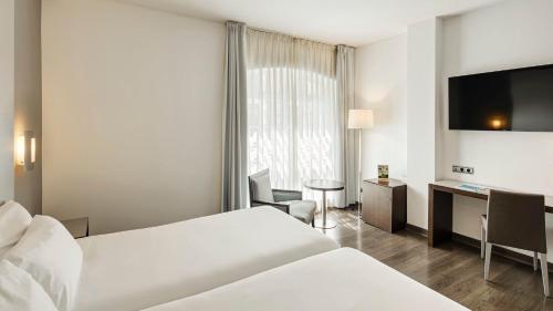 Habitación Doble Estándar - 1 o 2 camas del hotel Sercotel Coliseo. Foto 6