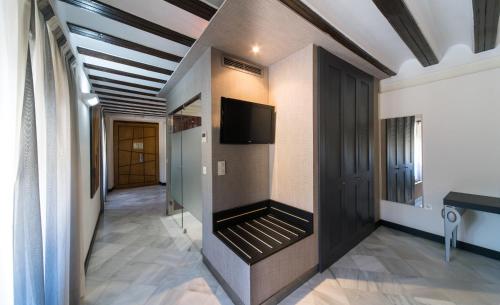 Habitación Doble con cama supletoria del hotel Palacio Marqués De Arizón. Foto 1