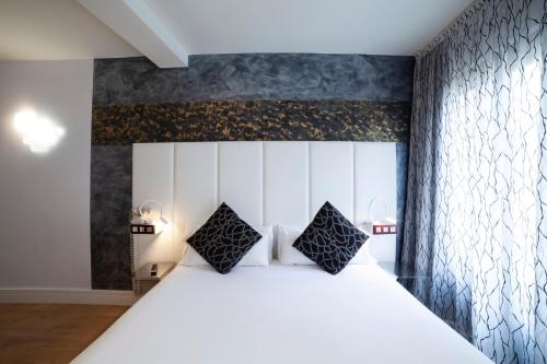 Habitación Cuádruple del hotel Petit Palace Savoy Alfonso XII. Foto 4