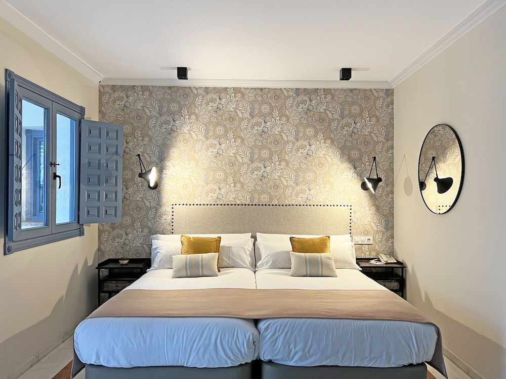 Habitación con 1 cama doble o 2 individuales del hotel Itaca Sevilla By Soho Boutique. Foto 1