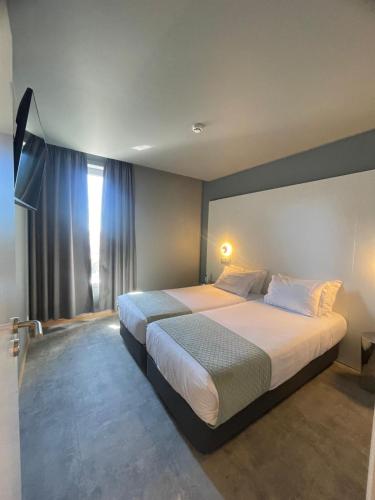 Habitación cuádruple del hotel Basic Braga By Axis. Foto 2