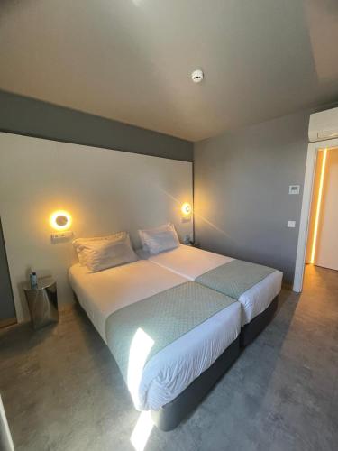 Habitación cuádruple del hotel Basic Braga By Axis. Foto 3
