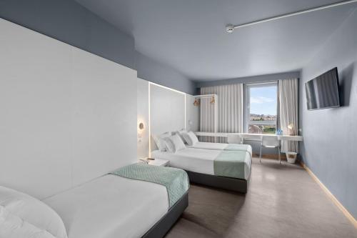 Habitación Triple del hotel Basic Braga By Axis. Foto 3