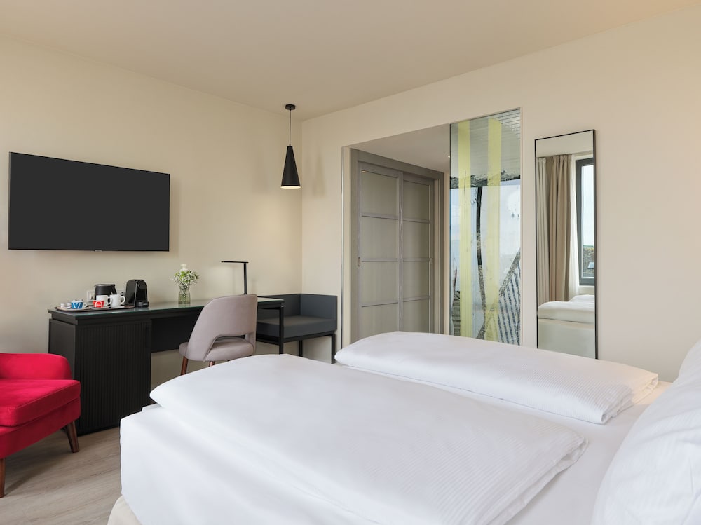 Habitación Deluxe del hotel H10 Berlin Ku'damm. Foto 6