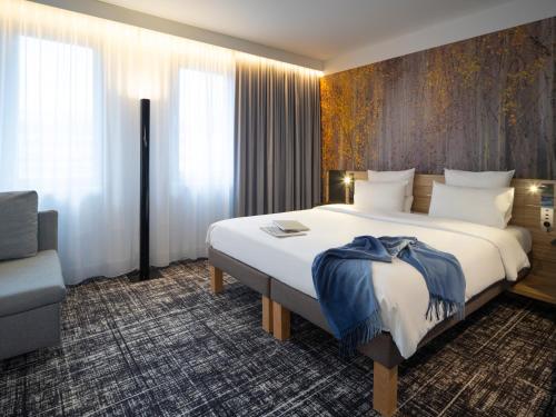 Suite Junior Business con cama extragrande del hotel Novotel Suites Wien City Donau. Foto 15