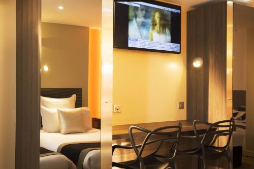 Habitación Triple Confort del hotel Brésil Opera. Foto 4