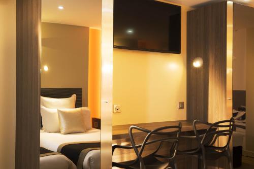 Habitación Triple Confort del hotel Brésil Opera. Foto 5