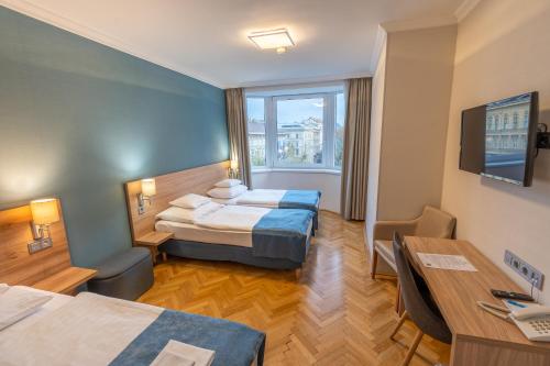Habitación Triple Confort del hotel Medos. Foto 2