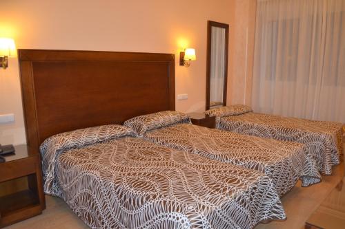 Habitación Triple Superior del hotel Abadía Camino Santiago