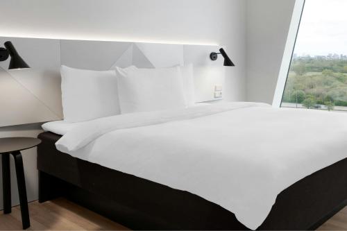 Habitación Deluxe más grande - Cama grande del hotel Ac Hotel Bella Sky Copenhagen