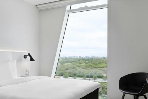 Habitación Estándar más grande con vistas a la ciudad - Cama grande del hotel Ac Hotel Bella Sky Copenhagen. Foto 1