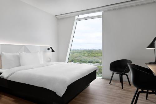 Habitación Estándar más grande con vistas a la ciudad - Cama grande del hotel Ac Hotel Bella Sky Copenhagen. Foto 2