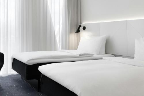 Habitación Estándar Grande - 2 camas individuales del hotel Ac Hotel Bella Sky Copenhagen. Foto 4