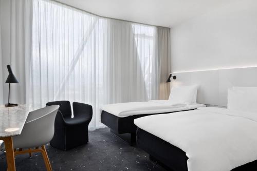 Habitación Deluxe - 2 camas individuales del hotel Ac Hotel Bella Sky Copenhagen. Foto 2