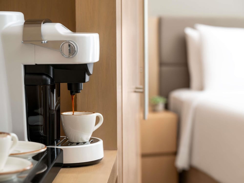 Suite con 2 camas individuales del hotel Novotel Suites Mall Avenue Dubai. Foto 5
