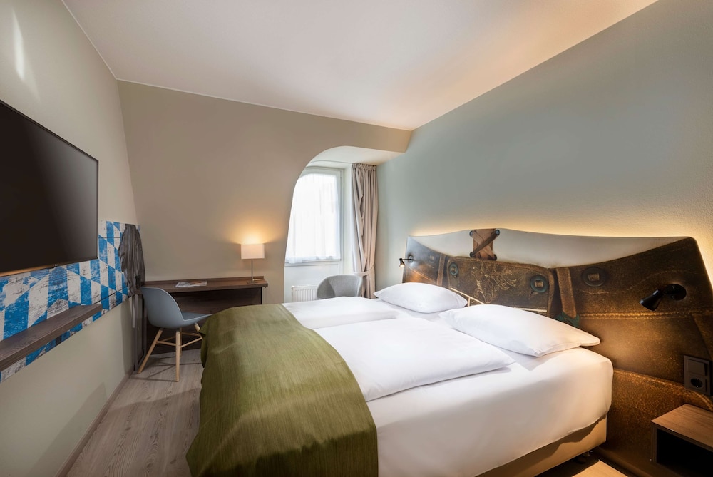 Habitación estándar con 2 camas individuales del hotel Ibis Styles Rosenheim. Foto 5