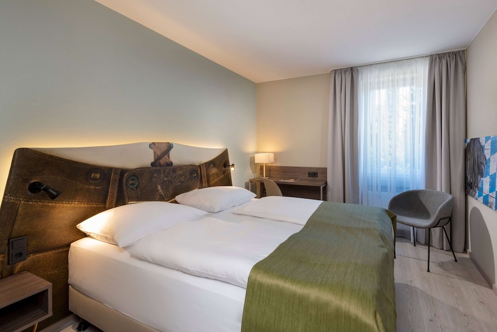 Habitación estándar con 2 camas individuales del hotel Ibis Styles Rosenheim. Foto 6