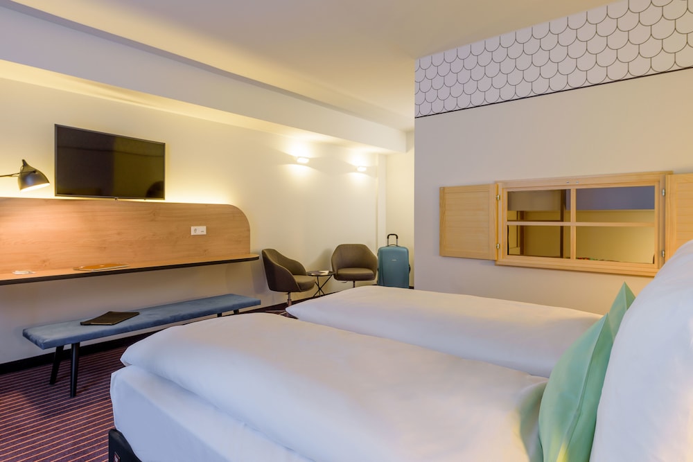 Espacio Todo Confort: 1 cama doble y camas individuales del hotel Ibis Styles Leipzig. Foto 1